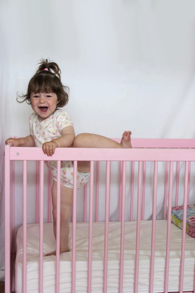 Baby moving around in cot best sale